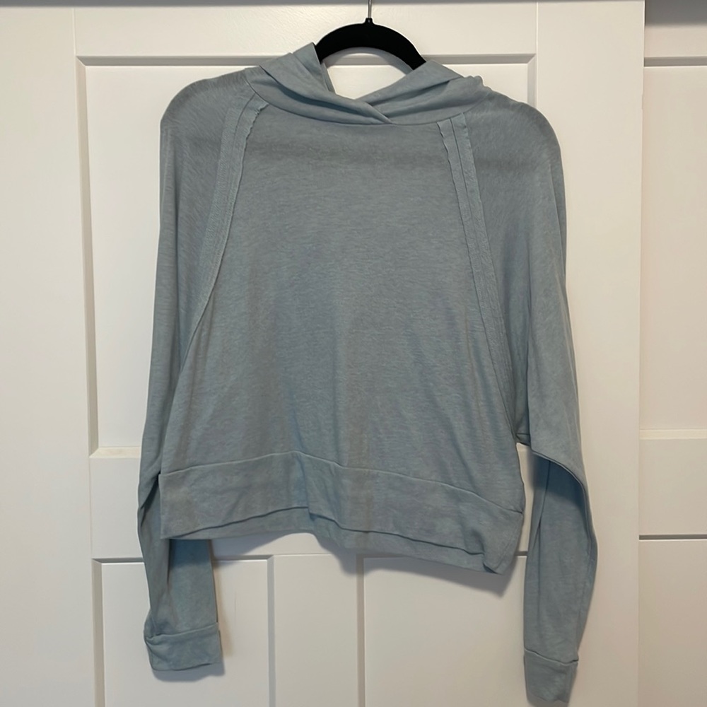 Cropped, hooded, long sleeve shirt. Very comfortable.